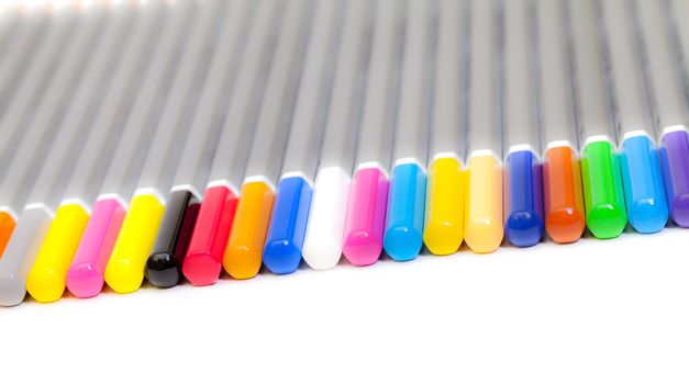 Multicolored Pencil, Arrangement in Row, glowing effect over white