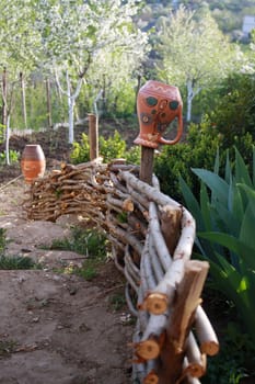 Ceramic pots on the wicker fence