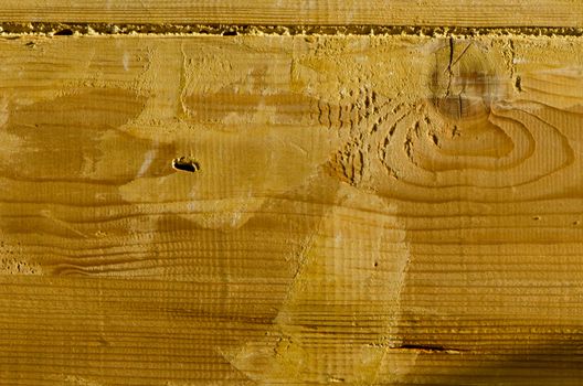 Wooden building wall plank closeup background details fragment.