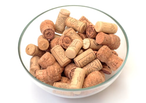 wine corks in bowl on white