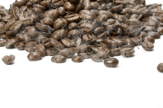 Fresh roasted coffee beans on a white background