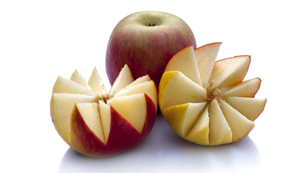 uncut apple and one in piece on white background