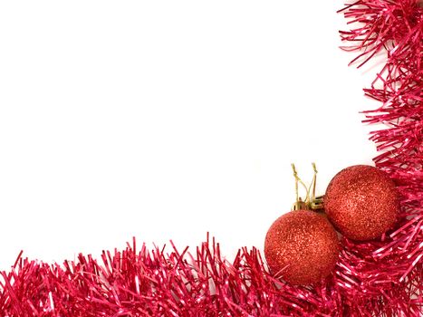 Red christmas balls and red decoration on white background.