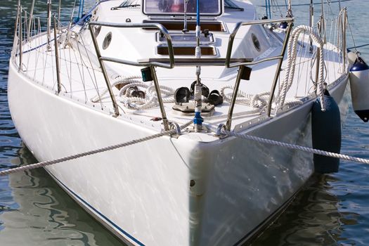 prow of ship white color, loosened on turquoise waves