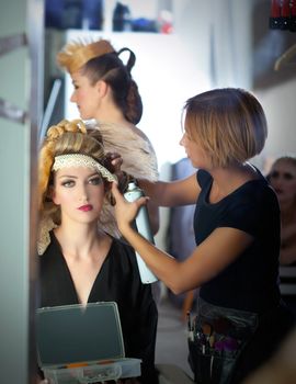 backstage hairdressing and makeup fashion with make-up artist