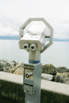 Silver coin operated pay binoculars