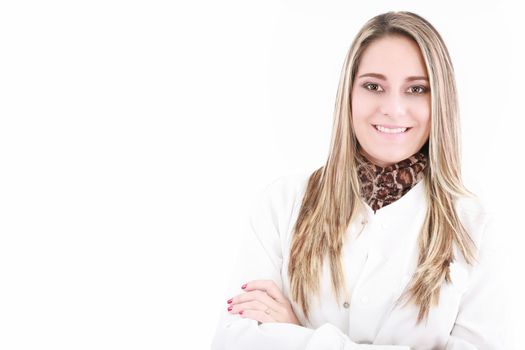 Portrait of happy young doctor woman standing with arms crossed.