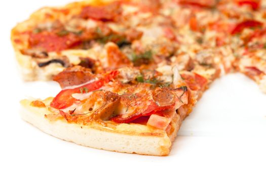 Slice of Pizza, closeup on white background.