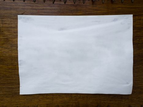 White paper stick on Wood wall background