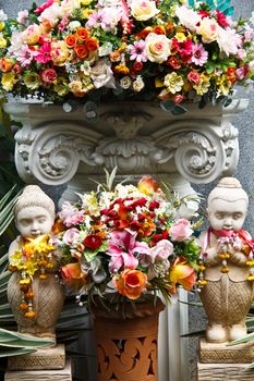 Bouquet of colorful flowers in the vase on the altar