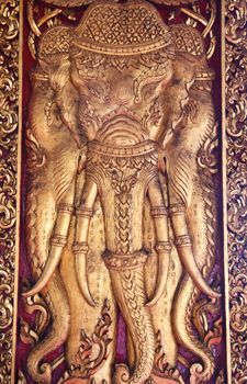 Elephant carved gold paint on temple door