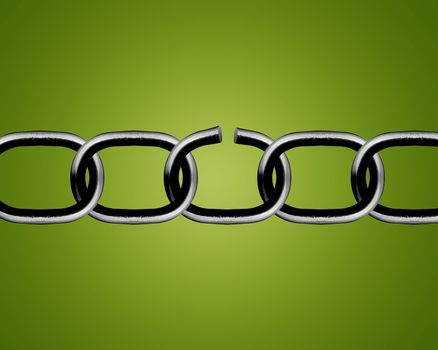 Broken metal chain parts on green background.
