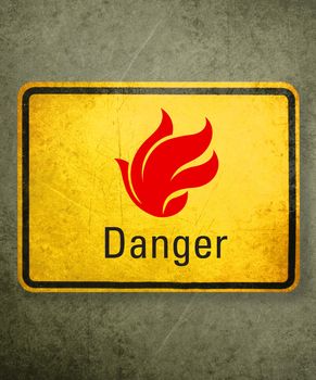 yellow fire alert sign on wall.
