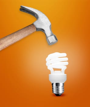 Hammer hitting a lightbulb .