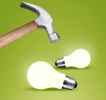 Hammer hitting a lightbulb .