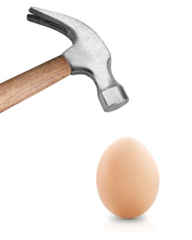 Hammer hitting an egg .