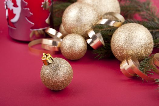 beautiful golden christmas decoration on red background sparkle