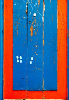 Vintage vivid blue and red wooden board lumbers. Bright colors. Vertical orientation.