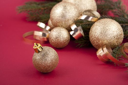 beautiful golden christmas decoration on red background sparkle