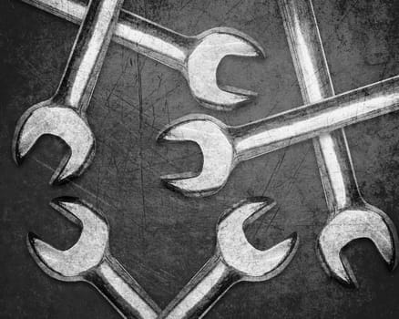 set of spanners or wrenchs on Scratched metal background.