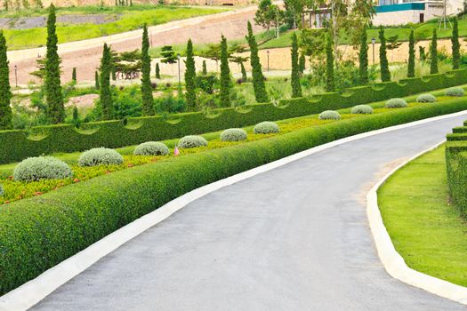 Beautiful garden beside the walkway in golf course