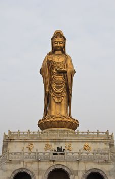 Guan Yin Statue wonderful, against Peaceful sky