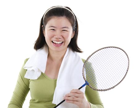 Happy Asian female holding badminton racket over white background