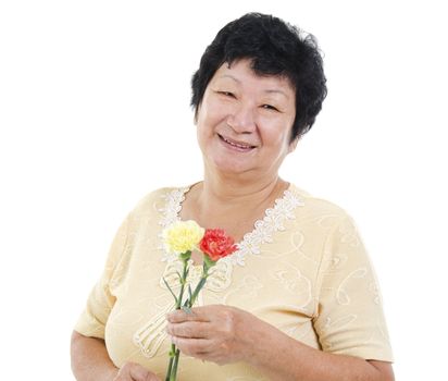 Happy Senior Asian Woman with carnation flower