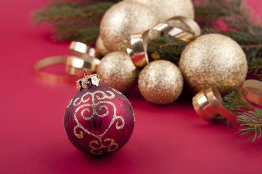 beautiful golden christmas decoration on red background sparkle