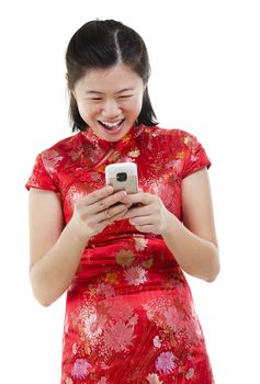 Happy oriental Asian woman using mobile phone to online / texting / sms , isolated on white background