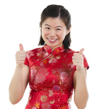 Thumbs up Asian oriental cheongsam woman over white background