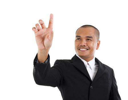 30s southeast Asian business man pointing on transparent virtual screen, space for text/button