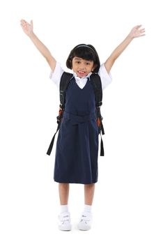 Six years old Southeast Asian school girl arms up in the air, fullbody over white background