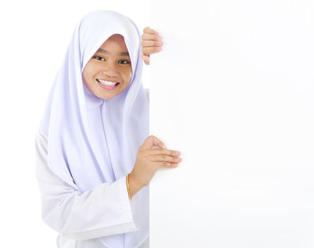Young Southeast Asian teen holding a blank cardboard ready for text