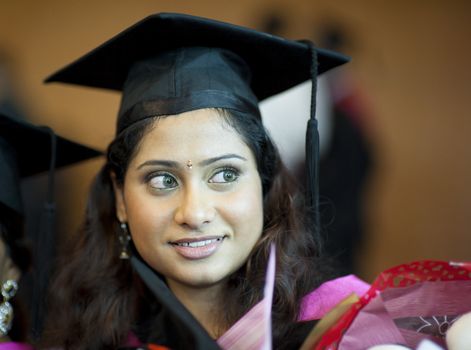 Happy Asian Indian female student in her graduation day