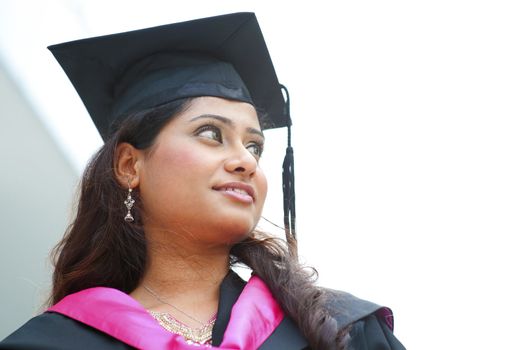 Young Asian Indian female student smiling and looking to bright side