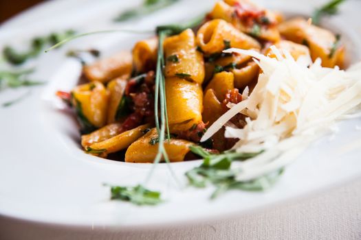 Italy, the best Florence restaurant. Example of Paccheri Pasta served at the table, no studio photo