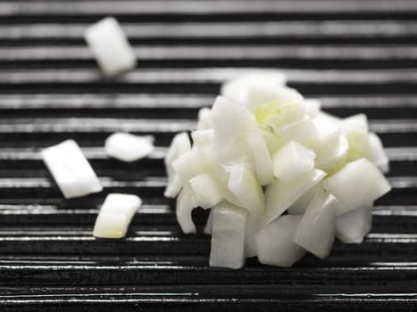 close up of chopped onions on a grill