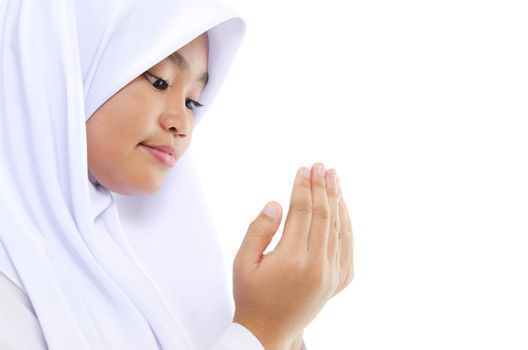 Close up Southeast Asian youth Muslim prayer is praying over white background