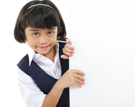 Southeast Asian schoolgirl hiding behide a white board