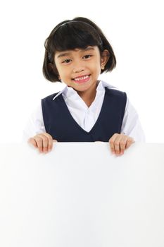 Southeast Asian schoolgirl holding a white board