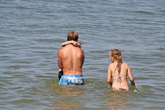 teenagers in the sea at cromer england