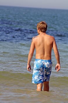 teenage boy in the sea