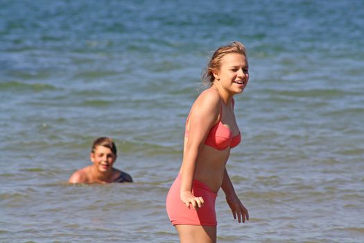 teenagers in the sea at cromer england