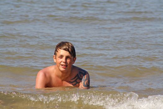 teenage boy in the sea
