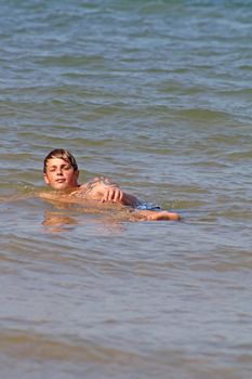 teenage boy in the sea