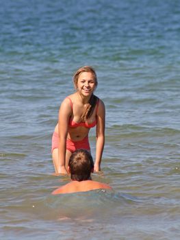 teenagers in the sea at cromer england