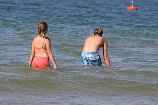 teenagers having fun in the sea