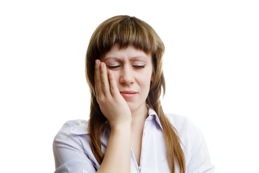 young woman with a toothache on a white background