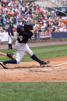 SCRANTON, PA - MAY 24: Scranton Wilkes Barre Yankees batter Justin Maxwell swings during a game against the Indianapolis Indians at PNC Field on May 24, 2011 in Scranton, PA.